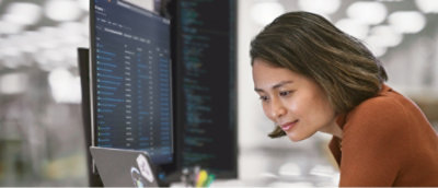 A woman looking at a computer screen.
