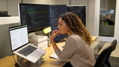 A women using her laptop in office.