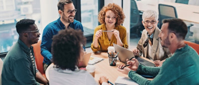A group of people sitting around a table.