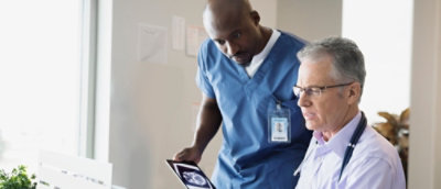 A doctor looking at a patient's x-ray.