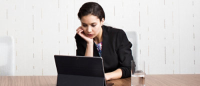 A person looking at a laptop.