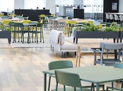 An image of an empty office with chairs, tables, and sofas.