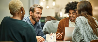 A group of people sitting around a table.