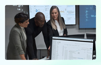  Team reviewing data on multiple screens.