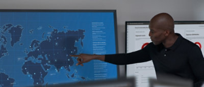 A person pointing at a map.
