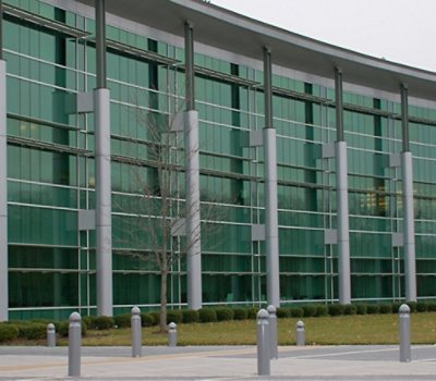 Modern office building with large glass windows.