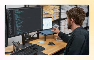 A person sitting at a desk using a computer.