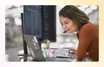 A person looking at a laptop screen.