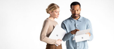 A man and woman holding folders and a pen.