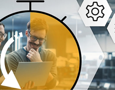 A man in glasses is sitting in front of a computer.