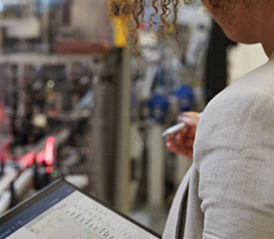 A woman working on a tablet device