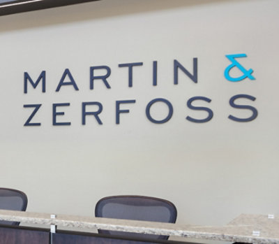 Office reception area with "Martin & Zerfoss" in bold letters on a light wall.