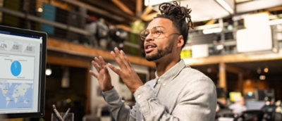 Man talking with hands raised up