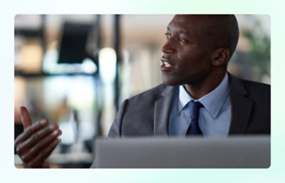 Businessman speaking during a meeting in an office.