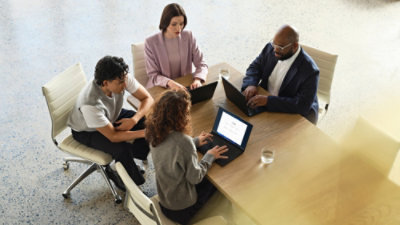 Business professionals in a meeting, symbolizing AI-driven transformation in financial services.