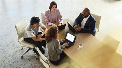 Person using a laptop inside a car.
