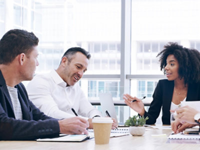 Team in a meeting around a table.