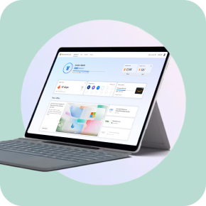 A Surface laptop framed in a white circle on a pale green background