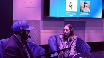 A man and woman sitting in chairs.