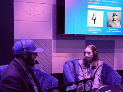 A man and woman sitting in chairs.