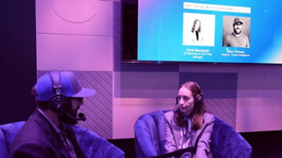 A man and woman sitting in chairs.