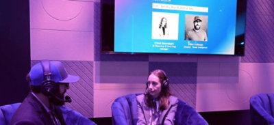 A man and woman sitting in chairs.