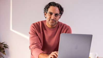 A man working on a laptop.