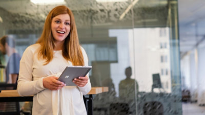 A person holding a tablet.