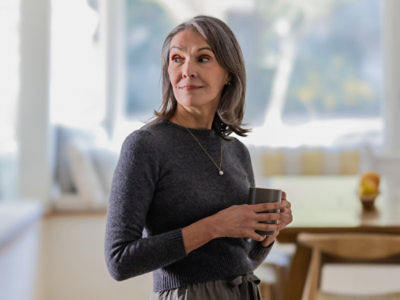 A woman holding a cup.