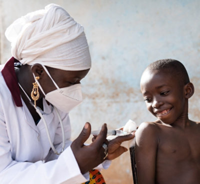 A doctor giving a child an injection