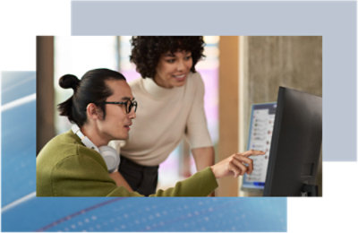 Two people looking at a computer.