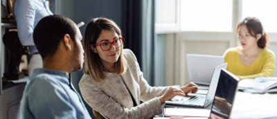 A man and women working on laptop