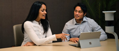 A man and women working on laptop