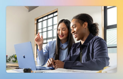 A men and women looking at a laptop