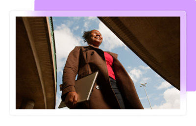 A woman holding a laptop.