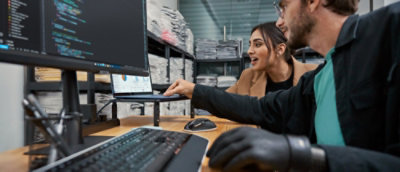 A group of people looking at a computer.