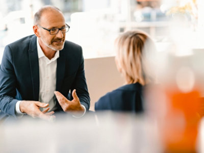 Man and woman looking at each other and talking