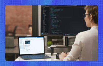 A man sitting at a desk with a laptop.