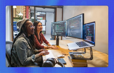 A group of women looking at computers