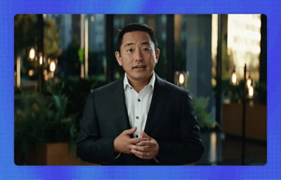 A man in a suit looking at the camera.