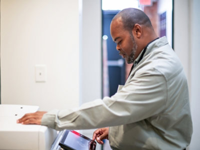 A person working on the printing machine