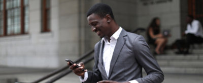 A man looking at the mobile screen