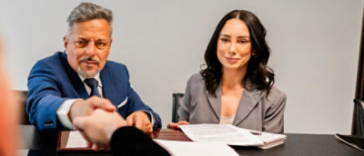 Two people working on some papers
