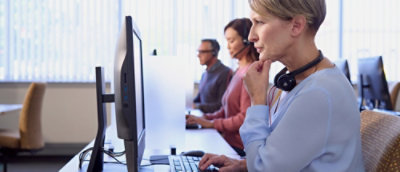 People looking at the screen in the office environment