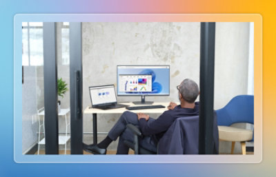Man sitting at desk looking at screen