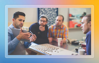 Team meeting looking at tablet