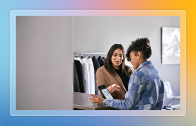 Team having meeting and discussing while looking at a screen
