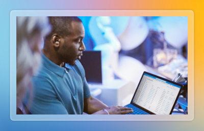 Two people looking at screen on laptop