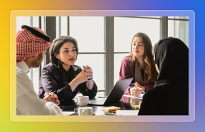 A group of people sitting around a table.