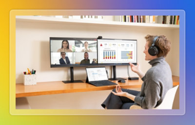 Person participating in a video conference on a desktop monitor.